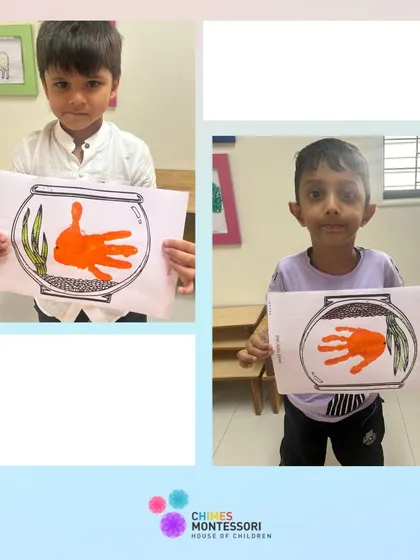 Two boys proudly display their handprint fish art, a fun activity that combines sensory experience with creativity.