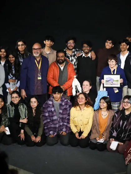 The French performer of 'Wings & Roots' poses with our founder and a group of enthusiastic students after the show.