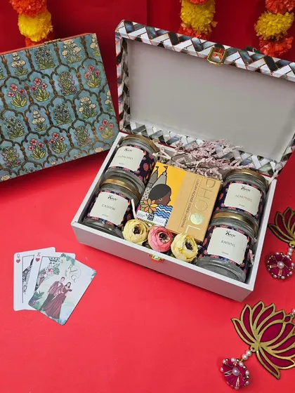 This elegant Diwali hamper features a stunning floral-patterned trunk box. Inside, we've curated a selection of premium dry fruits, chocolates, and playing cards for the festive season.