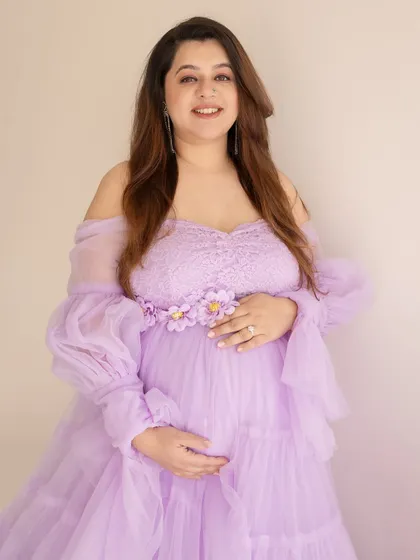 A happy and glowing portrait in a lovely lavender gown. Her bright smile is the best accessory.