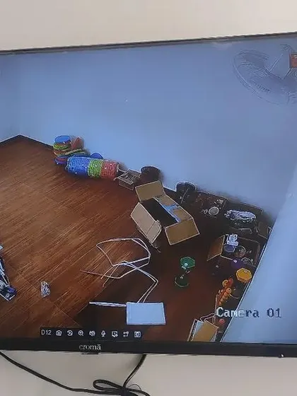 Duplicate of 44, showing an indoor room during setup.