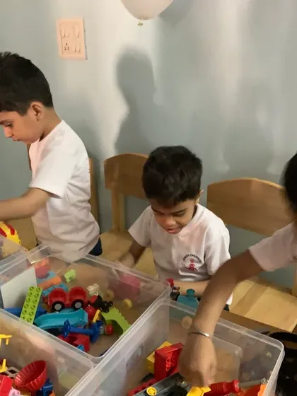 Our youngest learners engaged in building with DUPLO blocks, developing fine motor skills and an early introduction to engineering concepts.