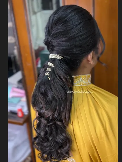 A close-up of the stylish ponytail, highlighting the clean twist at the base.