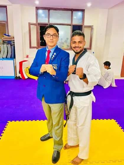 A proud moment with Grandmaster Pervez Khan (8th Dan Black Belt) after I achieved my 2nd Dan Black Belt. Continuous learning is a journey I share with my students.