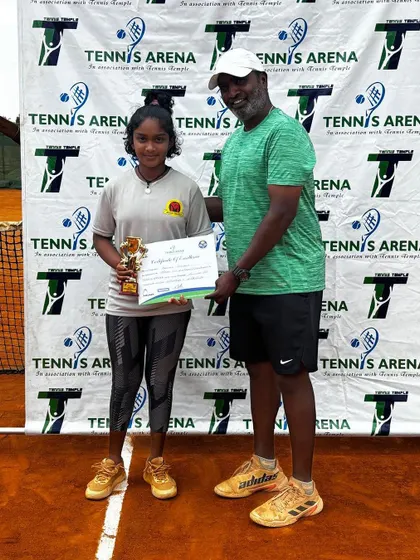 Eshita receiving her trophy at the TS7 Under 14 tournament in Bangalore. A successful week with both a singles final and a doubles win.