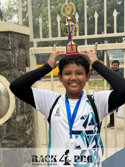 The joy of achievement! Pulkit Sugara with his trophy and medal after a successful run at the Pragyan School Inter-School Tournament.