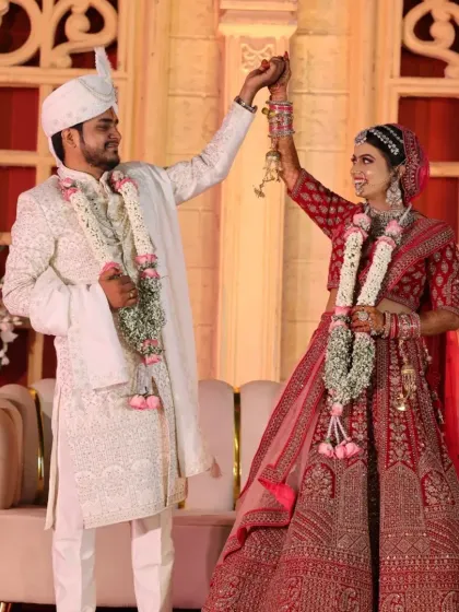 A joyful moment between the bride and groom. Her makeup was designed to look stunning from every angle and last through all the ceremonies and celebrations.