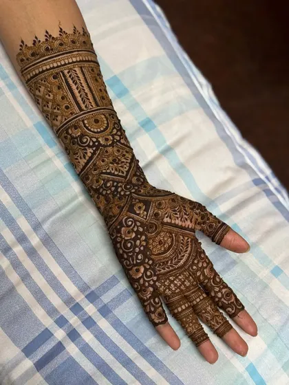 This is a detailed view of my intricate bridal henna work. Each design is unique, combining traditional patterns like paisleys and mandalas with fine-line fillers to create a stunning, full-coverage look for your special day.