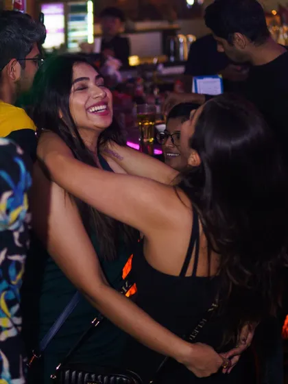 The best nights are about connection. Friends sharing a hug and a laugh on the dance floor is what a great party is all about.