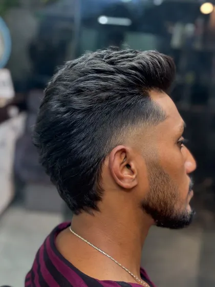 A side profile of the pompadour-mullet.