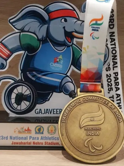 A close-up of the gold medal and 'Gajaveeran' mascot trophy from the 23rd National Para Athletics Championship. Every medal represents countless hours of hard work and dedication.