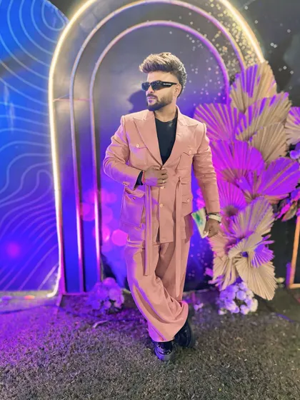 Another angle of the pink suit, showcasing its unique design and fit.
