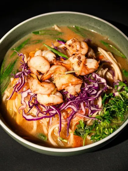 A soulful bowl of our Prawns Thukpa. This traditional Himalayan noodle soup is made with a rich, flavourful broth, tender noodles, crisp vegetables like cabbage and carrots, and topped with perfectly grilled prawns. It’s a complete, nourishing meal that feels like a warm hug.