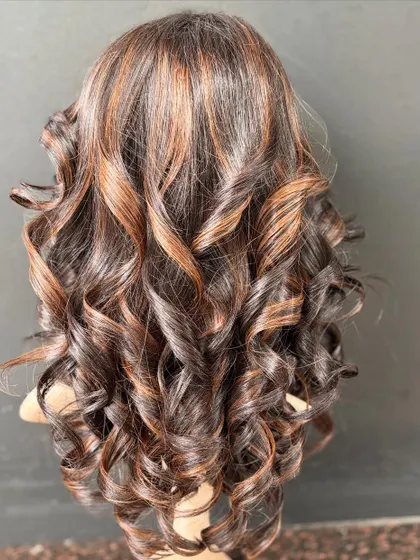 Another angle of the stunning molten honey wig, with perfectly crafted curls and highlights.