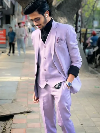 A sharp lavender three-piece suit, styled here with a black turtleneck for a modern and fashionable look. This suit is available for rent for parties, farewells, or photoshoots.