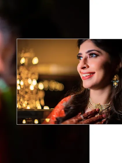 A close-up portrait of the bride with a beautiful bokeh background. Her happy smile and the warm lights create a magical and celebratory feel.