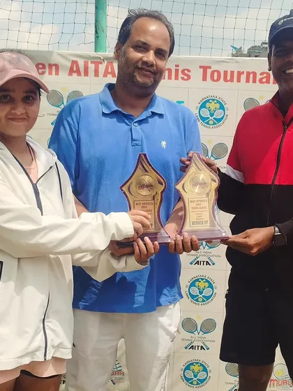 Presenting the Open Doubles Finalist trophies to Lavanya and Arun Kumar. We encourage mixed-gender participation and host various doubles formats.
