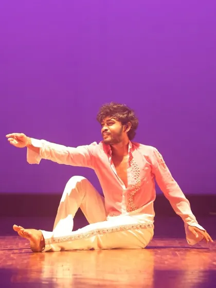 An expressive moment from a contemporary solo performance. Our training encourages dancers to connect with the music and convey emotion through their movements.