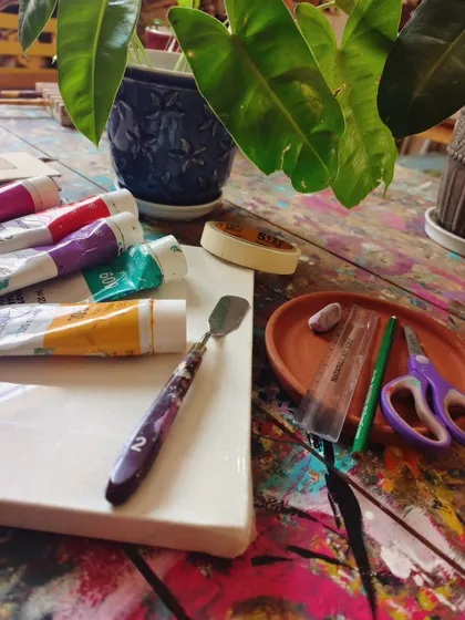 A blank canvas and a fresh set of supplies, ready for a new project to begin. We provide everything you need to explore different mediums of art with us.