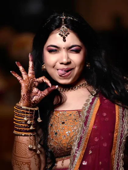 A fun and playful portrait of a bride. Her quirky expression shows her fun-loving personality, proving that bridal photos can be both beautiful and full of character.