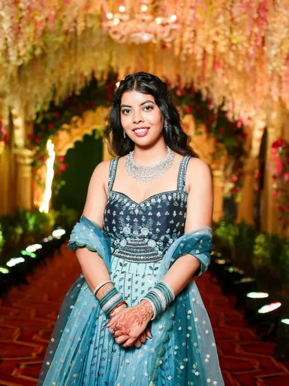 A beautiful party look for a wedding guest. The makeup is soft and elegant, with a focus on glowing skin and a simple hairstyle.
