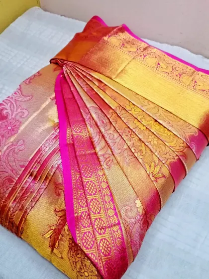 A final look at this stunning pink and gold saree. My service ensures that your investment in beautiful sarees pays off with a perfect drape every time.