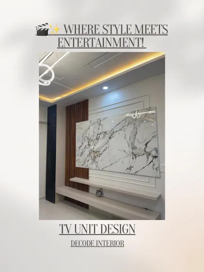 A TV unit should be more than just functional; it should be a centerpiece. This design combines a white marble-effect panel with dark wood fluting and floating shelves, creating a sophisticated entertainment hub in the living room.