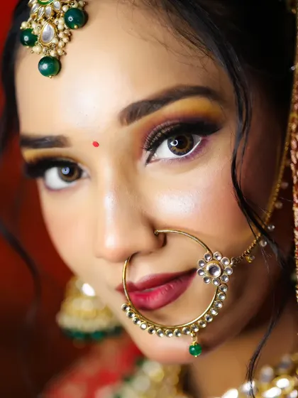 An extreme close-up on the eye makeup, showing the sharp winged liner and blended eyeshadow. Precision is key, and our mentors provide detailed feedback to perfect these skills.