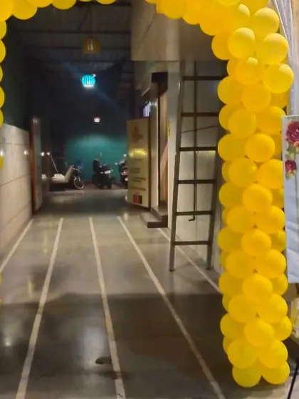 The entrance to a Haldi ceremony, marked by a bright yellow balloon arch that sets a festive tone right from the start.