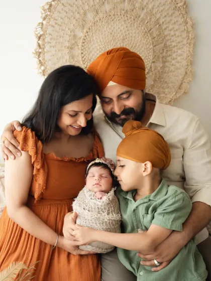 A heartwarming portrait of a family with their newborn and older son. My family photoshoots are designed to be relaxed and capture your natural connections.