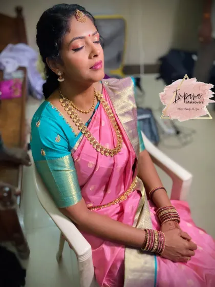 A serene moment as I complete a traditional look for a client. Notice the soft, blended eyeshadow and the perfectly defined features, all techniques that are part of my curriculum.