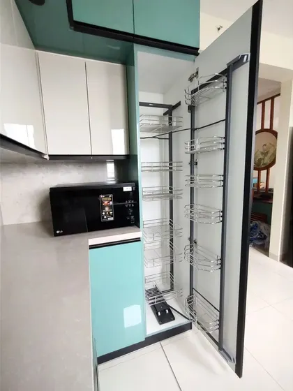 A tall pantry unit with a pull-out system is the ultimate storage solution for any kitchen. It offers incredible storage capacity and makes it easy to see and access all your dry goods at a glance.