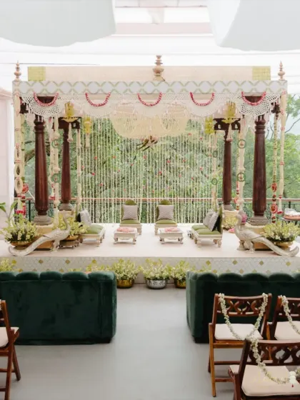 The 'Pastel Panchangam' mandap, set against a lush green backdrop, offers a serene and soulful ambiance. The design pays homage to heritage through a contemporary, minimal lens.