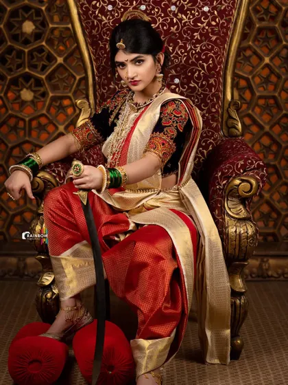 A slightly different pose from the Sreeleela warrior shoot, highlighting the flow of the saree and the intricate details of the jewelry. Each shot is carefully composed to offer a unique perspective.