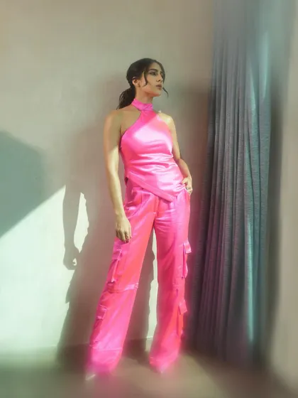 Another full-length pose that captures a thoughtful, off-gaze moment, adding a touch of narrative to the fashion story.