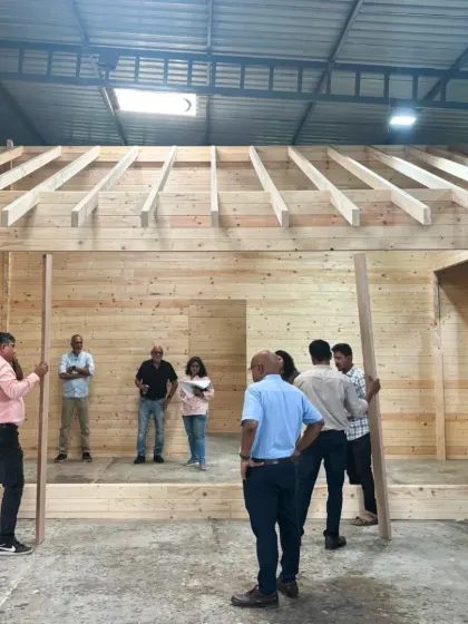 Inspect the prefabricated wooden wall panels for the Kanha treehouse. This off-site construction method ensures precision and quality while minimizing disruption to the natural forest environment during assembly.