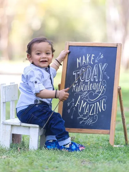 A positive message for a happy little guy. I use props like chalkboards to add a personal and inspirational touch to my sessions.
