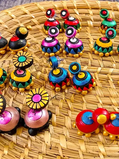 These images display the extensive variety of earrings I create, from jhumkas to studs and danglers, all showcasing different patterns, colors, and shapes ready for bulk orders.