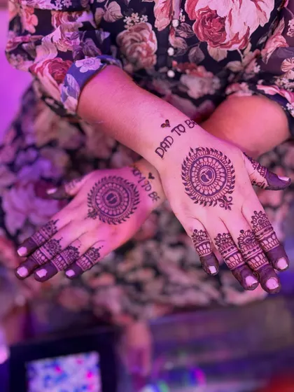 A simple yet elegant baby shower design for both the mom-to-be and dad-to-be. This features minimalist mandalas on the back of the hands with "Mom to be" and "Dad to be" written above, perfect for clients who prefer a lighter look.