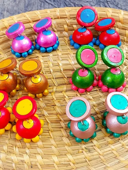 These images display the extensive variety of earrings I create, from jhumkas to studs and danglers, all showcasing different patterns, colors, and shapes ready for bulk orders.