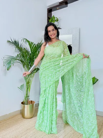 This pastel green Chikankari saree is so soothing and elegant. It's a versatile piece that can be dressed up or down for workwear or a small festive gathering.