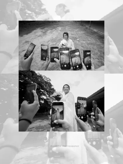 A fun, behind-the-scenes style shot, showing friends capturing the bride on their phones, a modern take on wedding memories.