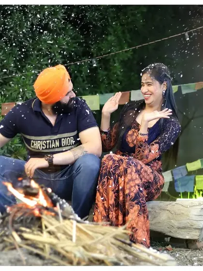 A cozy bonfire scene for a pre-wedding shoot. This setup is perfect for creating a warm, intimate, and romantic atmosphere, especially with the playful snow effect.