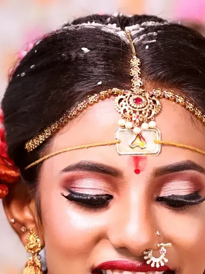A detailed close-up of the eye makeup for my bride Varsha. The soft pink and gold eyeshadow with a sharp winged liner enhances her eyes beautifully.