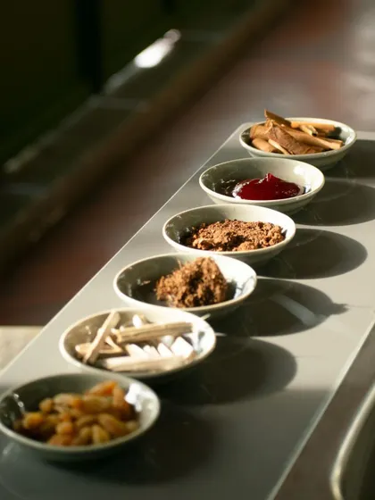A sensory exploration kit used in our chocolate profiling workshop. Each bowl contains a different element, from cacao nibs to spices, designed to train the palate and nose to identify the complex aromas and tastes in craft chocolate.