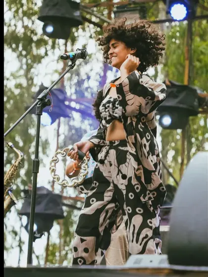 Modeling a stunning co-ord set from The Jodi Life during a live performance with my band. This shows how I can naturally showcase fashion in a high energy, authentic environment, connecting the brand with a live audience.