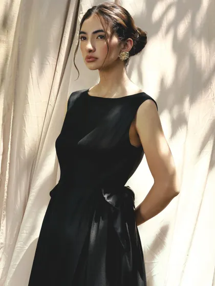 A duplicate of image 11, showing the classic and timeless look with a soft updo and defined eyes.