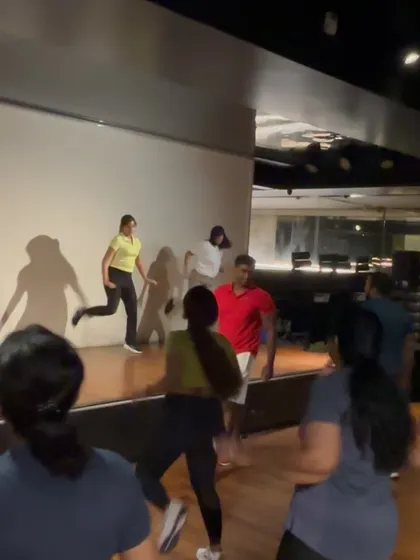 On stage with participants during a corporate wellness event.
