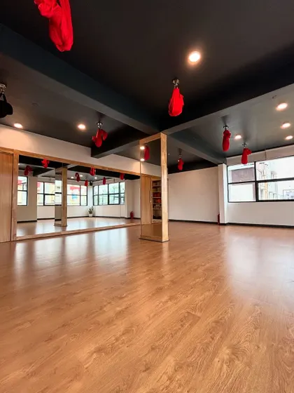 Another view of the main hall at our learning center, showcasing the expansive, mirrored space perfect for detailed instruction and practice.