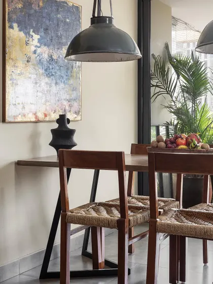 A comfortable reading chair next to the bed in the 'Reweave Stories' apartment. We always consider how our clients will live in the space, creating small, functional moments like this.